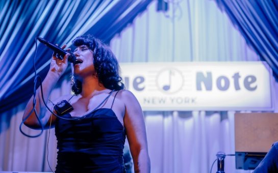 BRIT award winner Raye singing at Blue Note's New York venue. (Picture credit: Dervon Dixon)