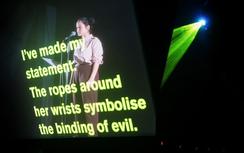 Kaja Chan as an interrogator performing in Chinese with English subtitles. (Picture credit: Alex Brenner)