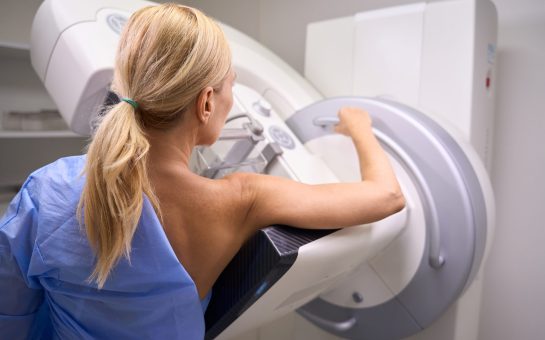 A woman getting a breast cancer screen