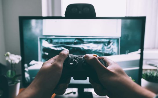 Person playing a video game (Credit: Free to use from Unsplash)