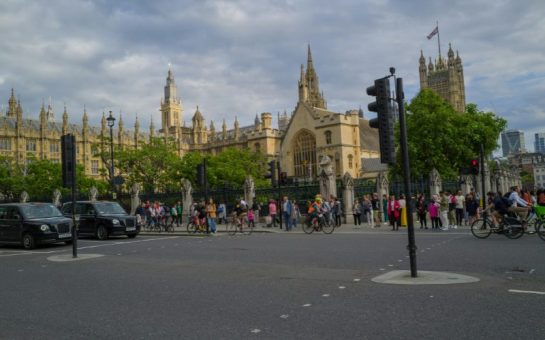 Photo of Westminster with lots of pedestrians.