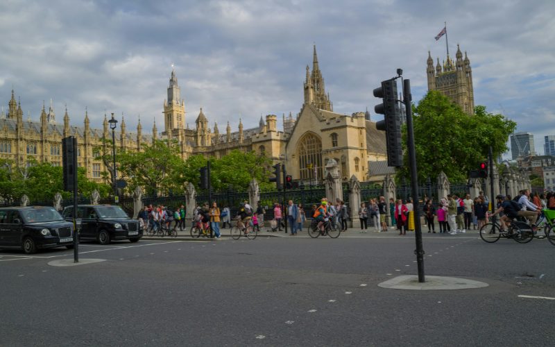 Photo of Westminster with lots of pedestrians.