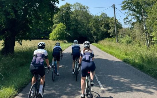 BellaVelo cycling club members on a group ride out on a summery day.