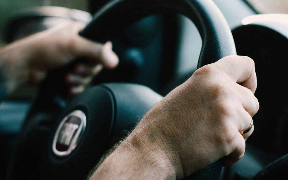 A driver at the wheel (Credit: Free to use from Unsplash)