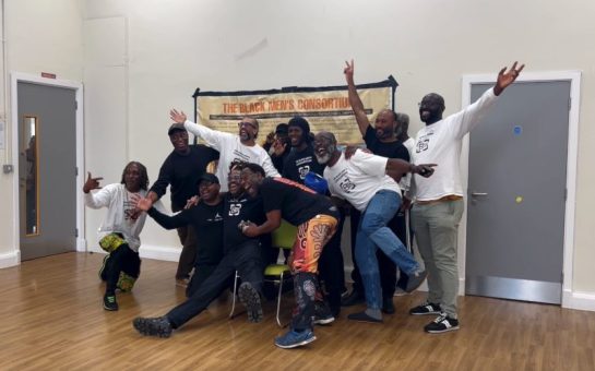 The Black Men's Consortium celebrate after May shows