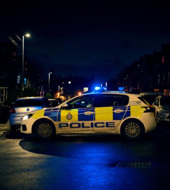 Police car on residential street at night