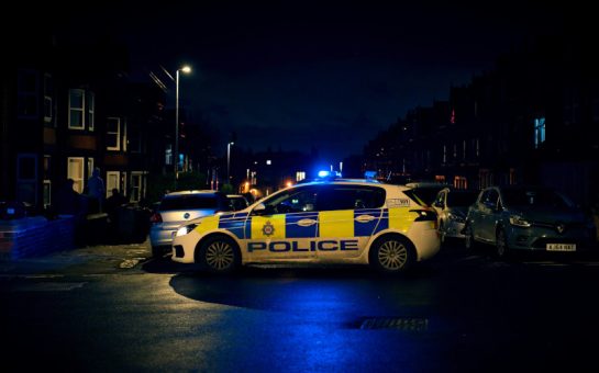 Police car on residential street at night