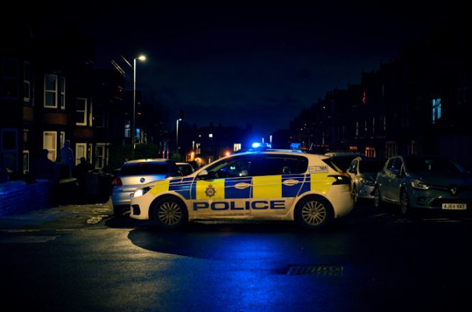 Police car on residential street at night
