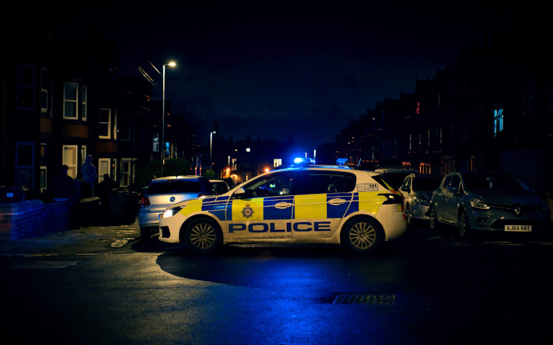 Police car on residential street at night