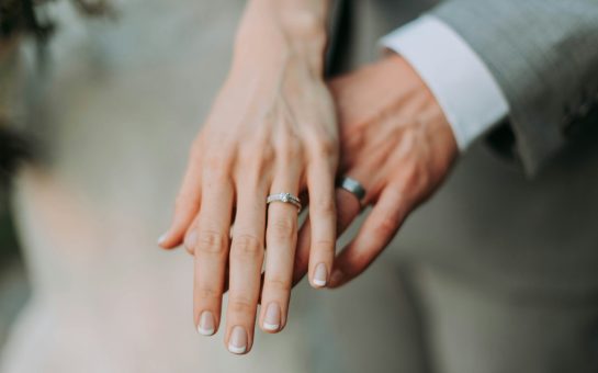 Weddings rings on the hands of a married, heterosexual couple
