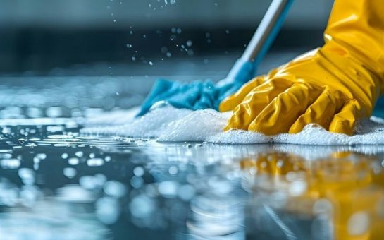 A person mopping and cleaning a floor (Credit: Free to use from Unsplash)