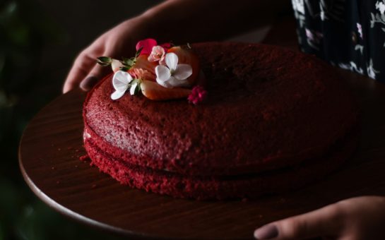 Person carrying a cake (Credit: Free to use from Unsplash)