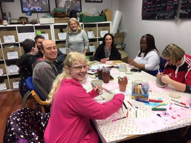 Participants at The People Hive partaking in arts and crafts