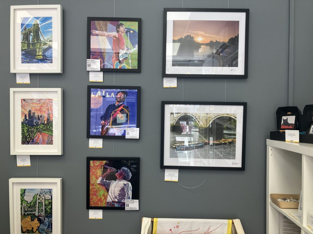 Art on display at The People Hive, including pieces depicting Mick Jagger, Roger Daltrey and Eric Clapton
