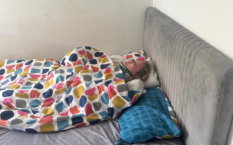 Woman lying on bed