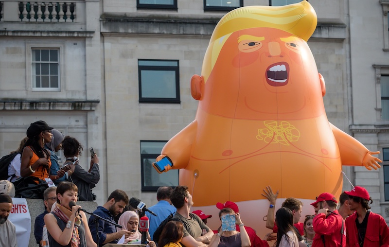 The Trump baby balloon in Trafalgar Square during an Anti Trump rally in Central London — (Credit : depositphotos.com / Triumph0828)