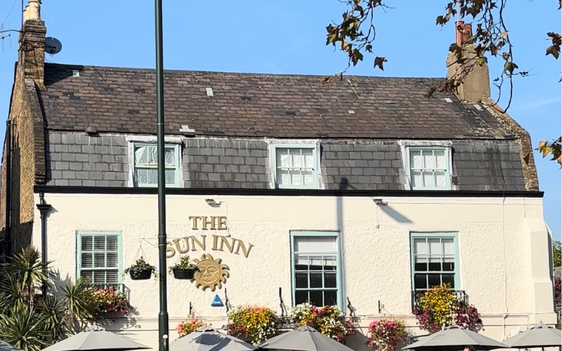 This is a picture of the Sun Inn pub, in Barnes. The club plays on the green behind it. 