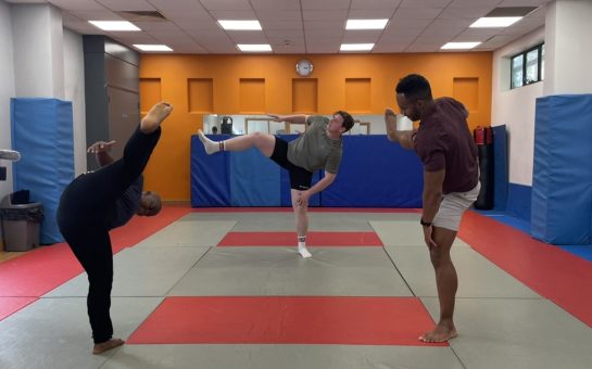Three members of London Sumo Club warming up