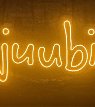 Juubi sign in fluorescent orange - sign of the new grassroots music Collective