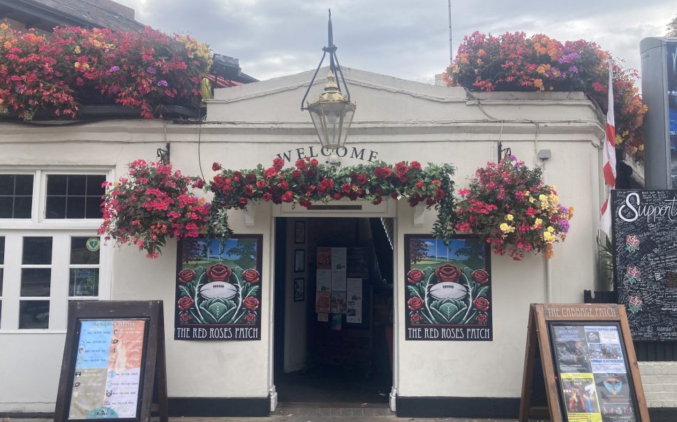 Street view of flowery Twickenham Pub, the Cabbage Patch