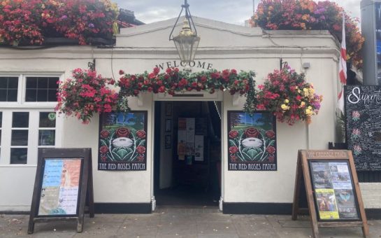 Street view of flowery Twickenham Pub, the Cabbage Patch
