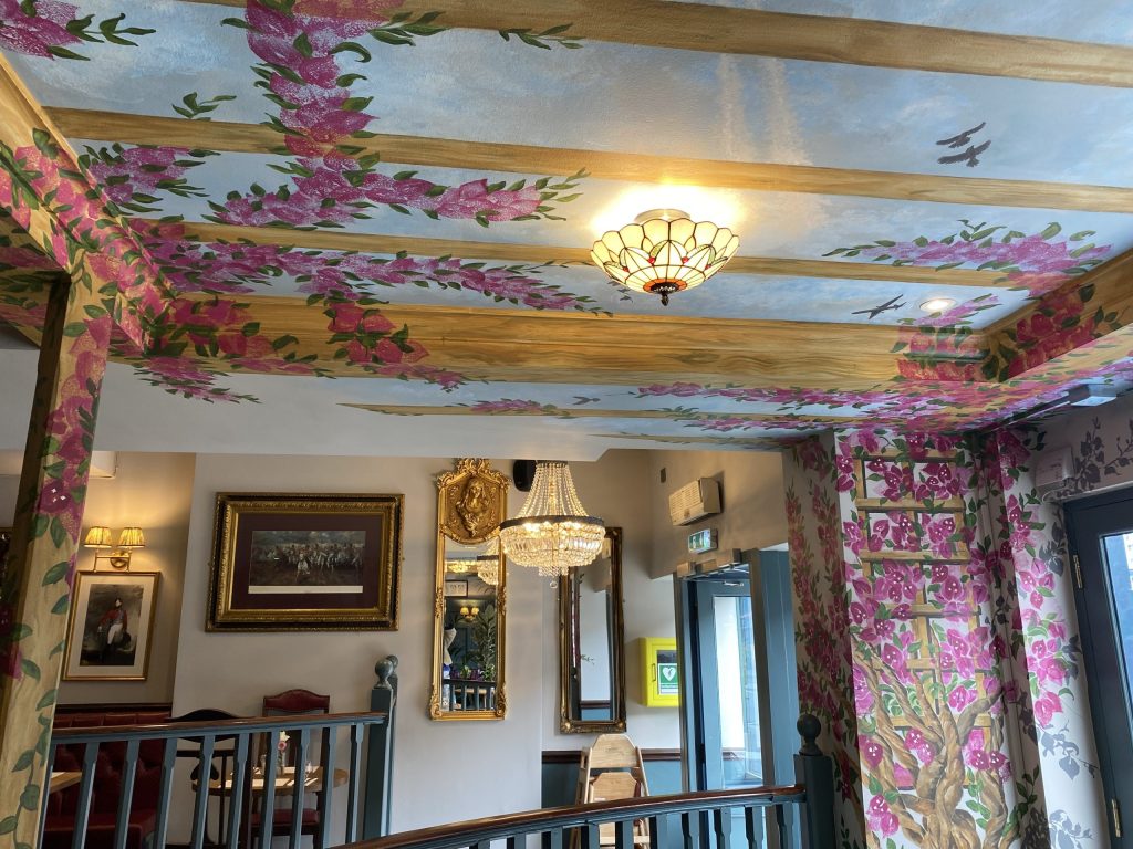 The hand-painted mural by A&K Art