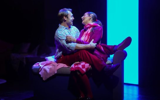 A man and a woman sing to each other on stage for London musical Love Quirks