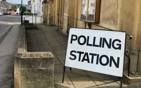 A picture of a sign saying "polling station"
