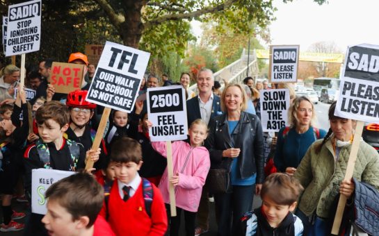 Protestors next to St Margarets roundabout with school students