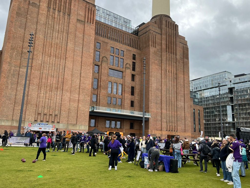 People trying to play flag football in front of Battersea Power Station