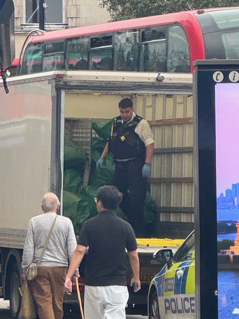 Police load up the confiscated drugs into van