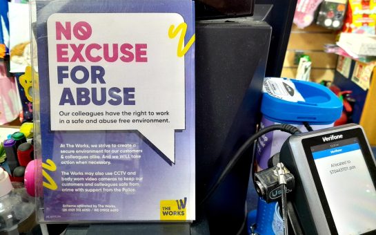 Sign warning against abusing staff in Feltham shop