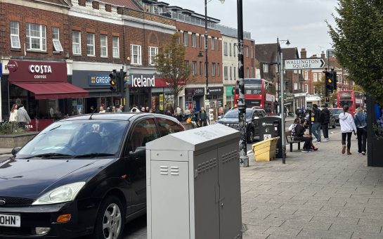 a row of store facades on a high street
