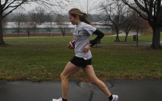 Woman having an early morning run in the park.