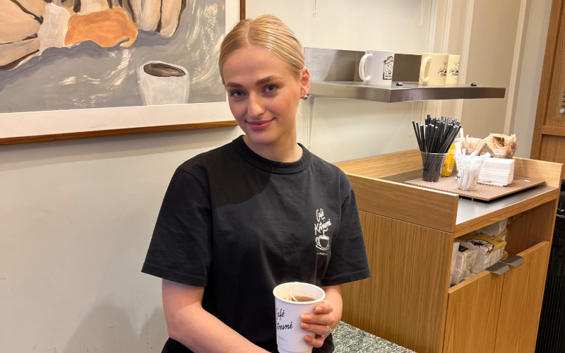 Angelina Zania, supervisor at Café Kitsuné holding Hojicha tea