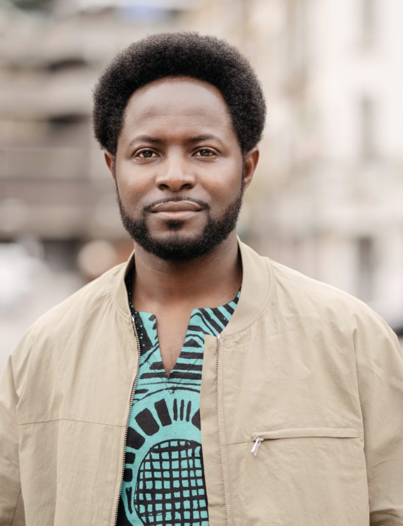 Headshot of Freddie Opoku-Addaie, the artistic director and CEO of Dance Umbrella. Credit: Miguel Altunaga.