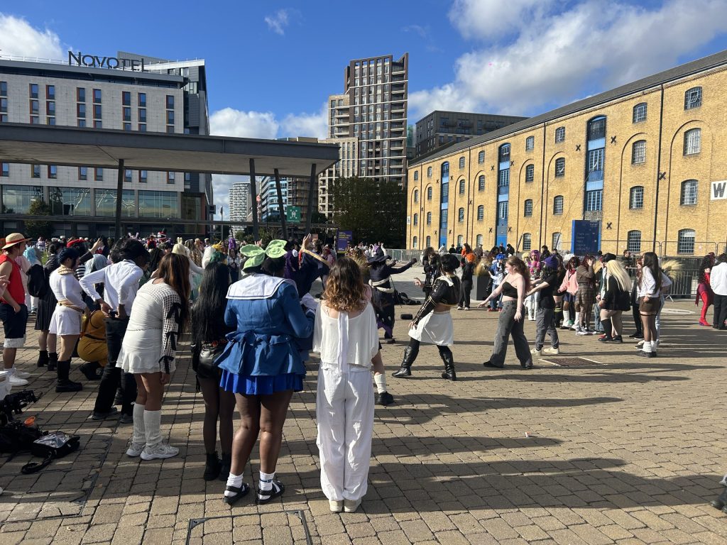 Onlookers support their friends dancing in the middle