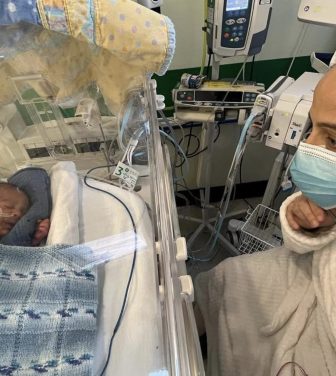 Mother, Eleasha, visits her baby