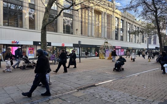 a row of store facades in a busy high-street