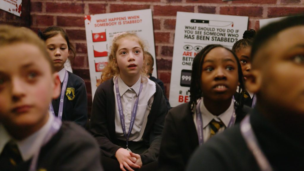 Image shows children at a knife crime prevention exhbition. Credit: Ben Kinsella Trust. 