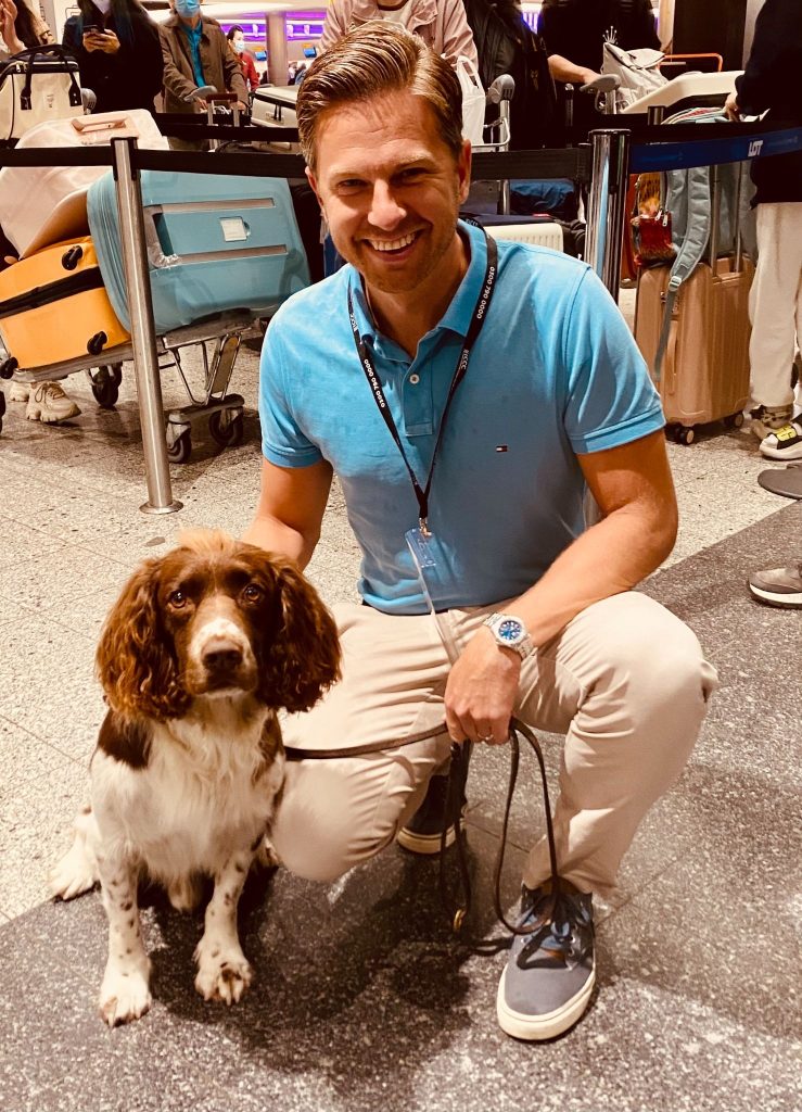 Tom Gaymor with a service dog as part of DIVERT London