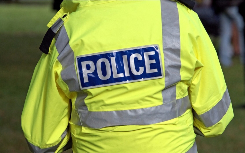 Police officer with their back turned to the camera