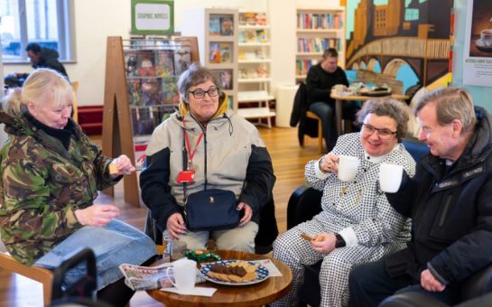 Wandsworth residents enjoying a warm drink whilst chatting in the warmth of their local library.