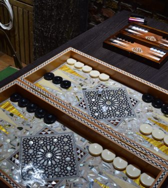 A backgammon board set up on a table