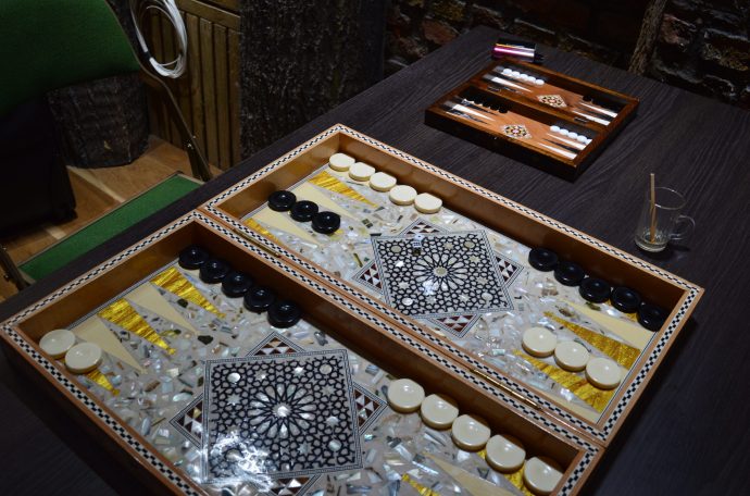 A backgammon board set up on a table