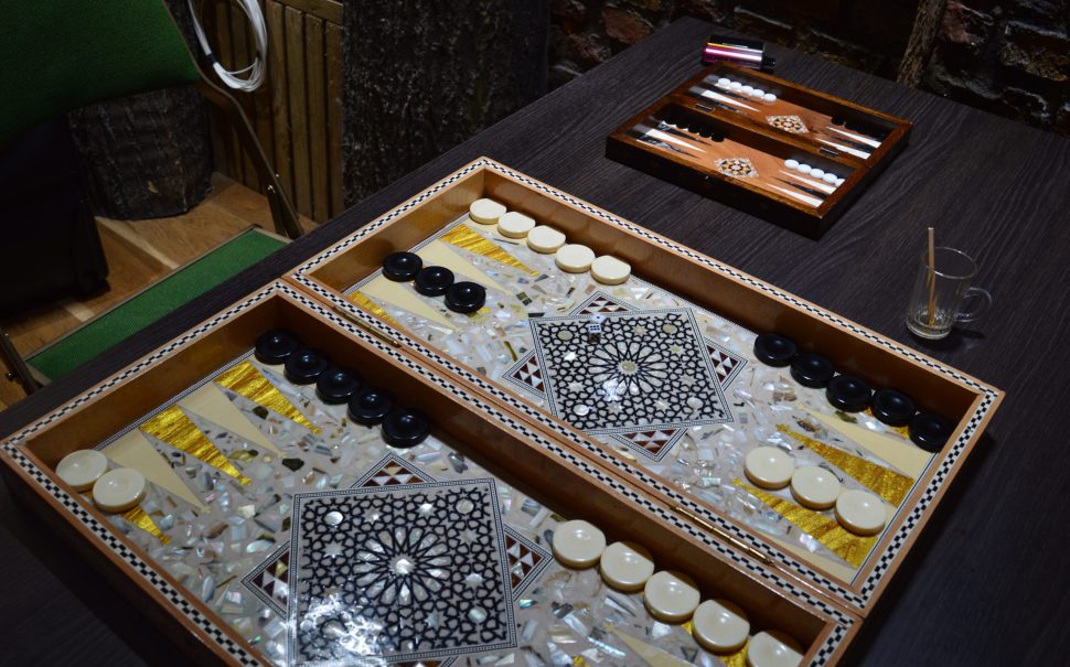 A backgammon board set up on a table