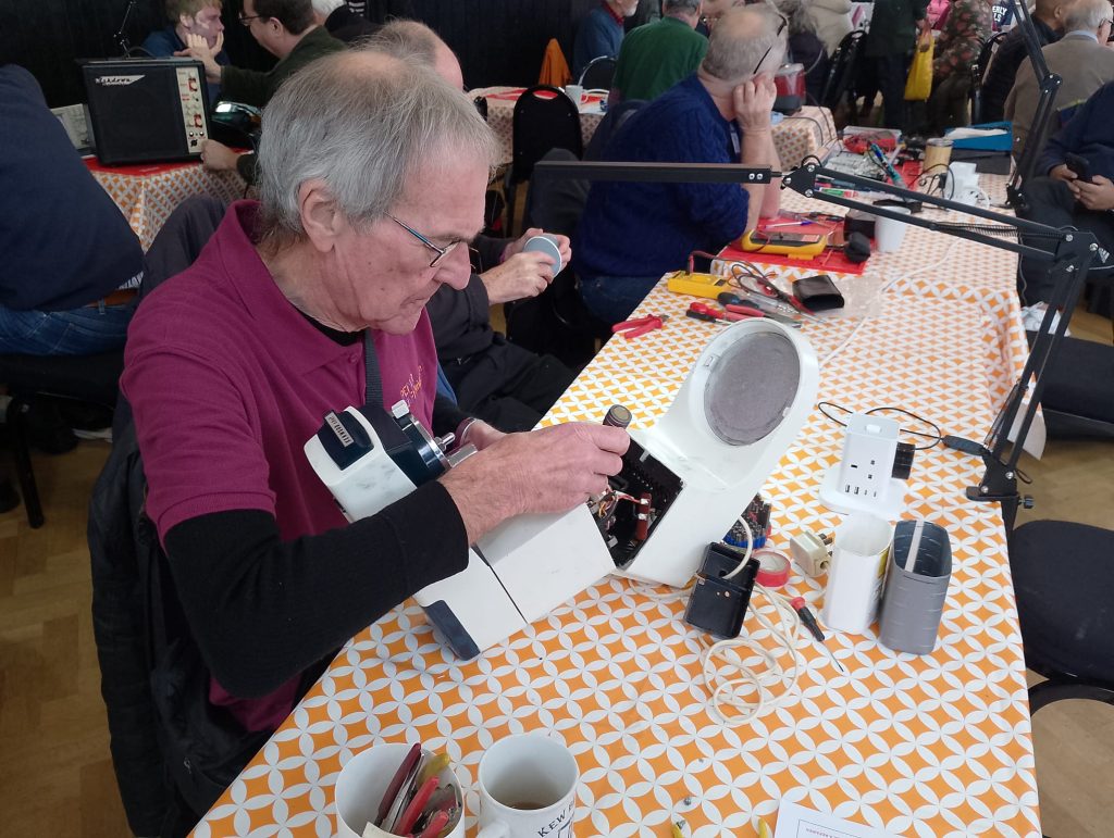 Volunteer repairers fix electronic household appliances at the Twickenham Repair Cafe.