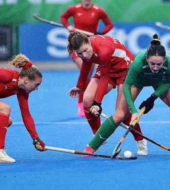 Women playing hockey