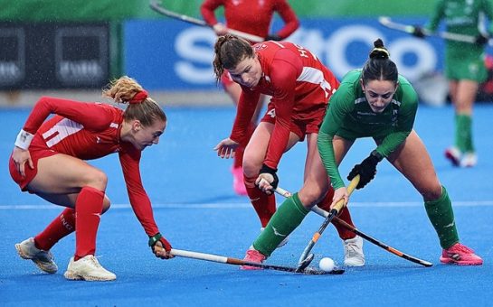 Women playing hockey
