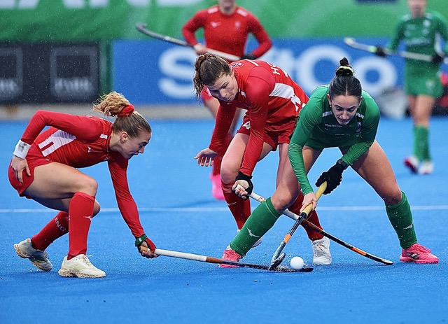 Women playing hockey
